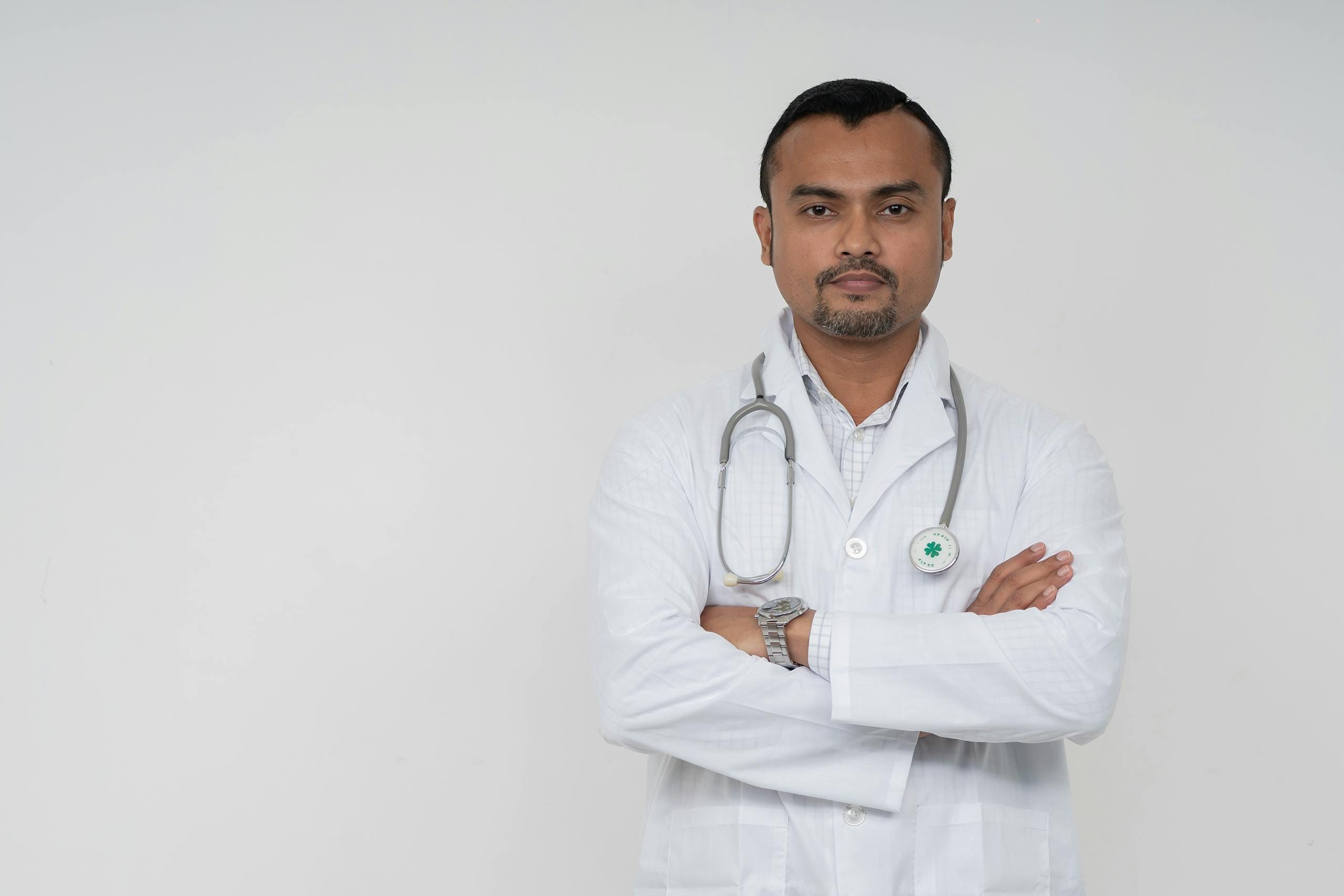 Doctor with arms folded - how many cigarettes a day is dangerous health research Melbourne