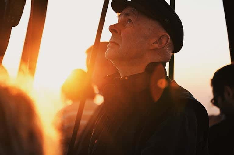 Older person looking hopeful outdoors - quit smoking after 30 years Melbourne Breathe Hypnotherapy