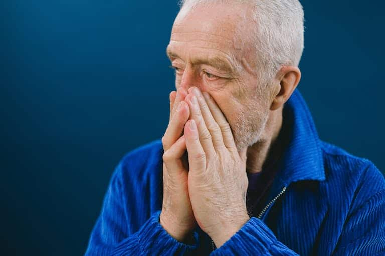 Smoking and Erectile Dysfunction: The Dangerous 41% Risk Increase Australian Men Aren't Talking About 10 A man looking concerned representing the link between smoking and erectile dysfunction and the 41% higher risk Australian male smokers face