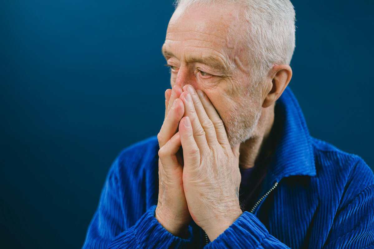Smoking and Erectile Dysfunction: The Dangerous 41% Risk Increase Australian Men Aren't Talking About 1 A man looking concerned representing the link between smoking and erectile dysfunction and the 41% higher risk Australian male smokers face
