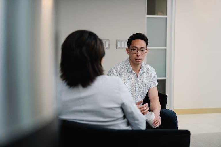Smoking and Depression: The Dangerous Loop Affecting 1 in 3 Australian Smokers 8 Two people in a supportive conversation representing how to help someone quit smoking with the right strategies and without creating resistance