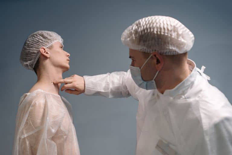 Dermatologist examining a patient's skin for smoking skin conditions